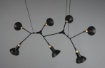 Immagine di Lampadario Sospensione Industrial 7 Spot Calotte Orientabili Roxie Nero e Oro Trio Lighting