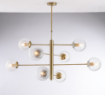 Immagine di Lampadario Oro Bronzato Design Contemporaneo 8 Sfere Vetro Trasparente Demetra Bonetti