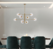 Immagine di Lampadario Oro Bronzato Design Contemporaneo 8 Sfere Vetro Trasparente Demetra Bonetti