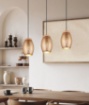 Immagine di Sospensione Caffè 3 Paralumi Inserto Legno e Tagli Laser Decorativi Bidar Trio Lighting