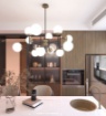 Immagine di Lampadario Per Soggiorno Regolabile Nero Ottone 12 Luci E27 Sfere Vetro Clear Top Light 1198